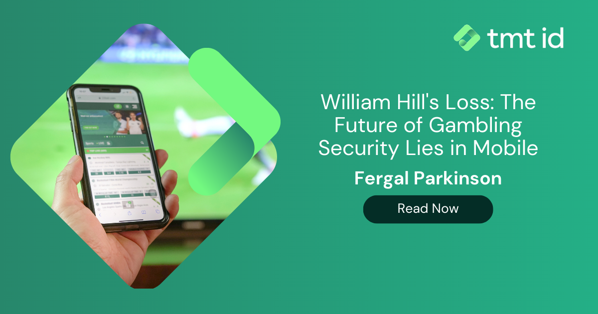 Hand holding smartphone with sports betting app on the screen against a background featuring an abstract design and text about silent authentication in gambling security article.