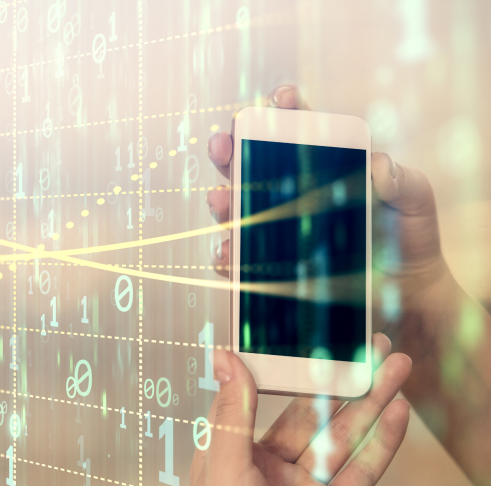 Hand holding a smartphone with digital binary code overlay.